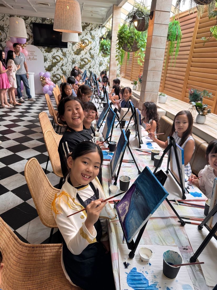 A group painting together in a bright pub
