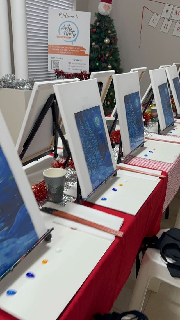 Easels, canvases and table covers set up before guests arrive